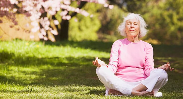 Elderly woman meditating with hip joint